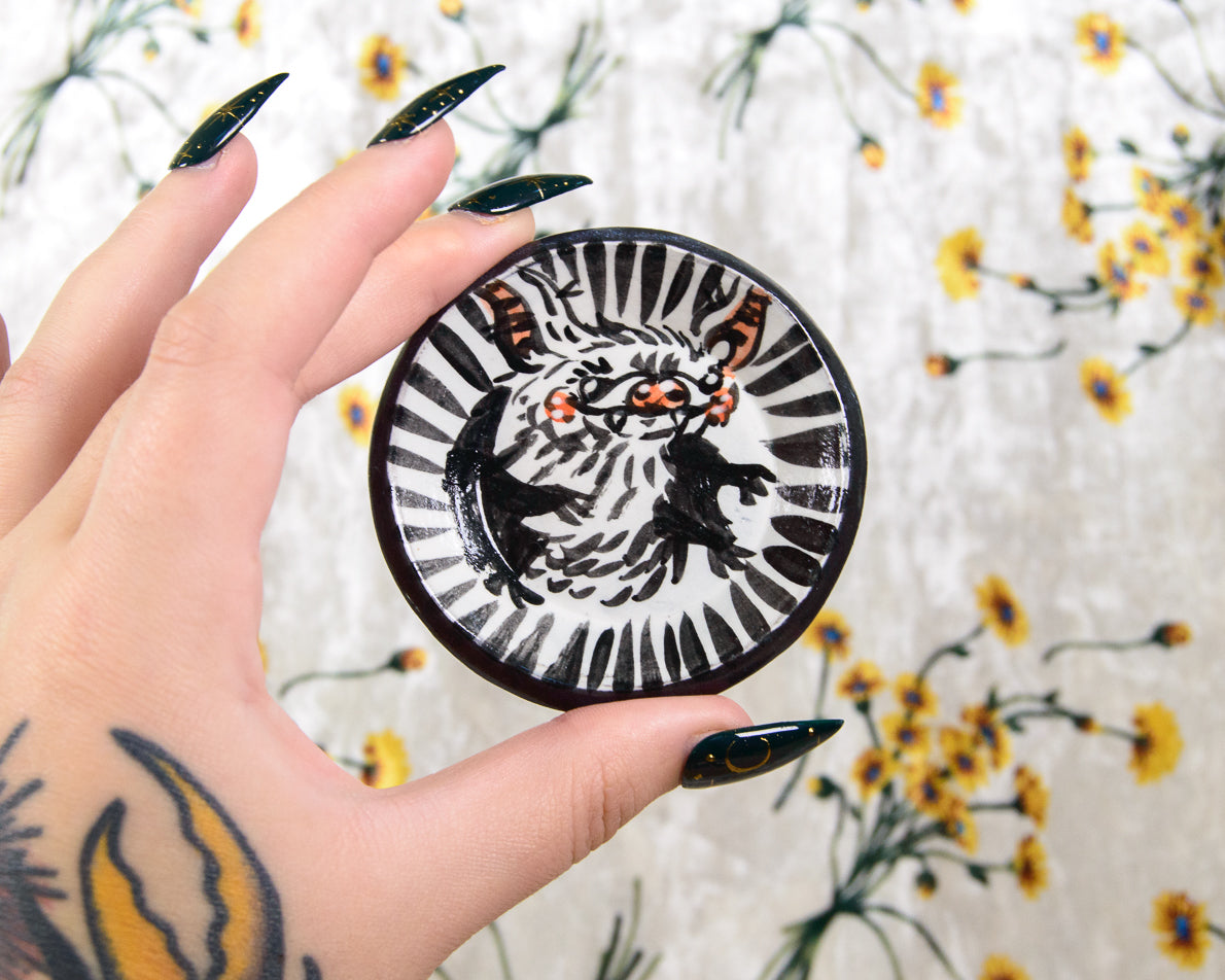 Decorative ceramic ring dish with a cute cartoon bat design