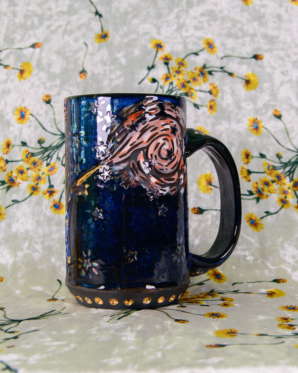Handmade ceramic mug with cartoon magic swirl designs