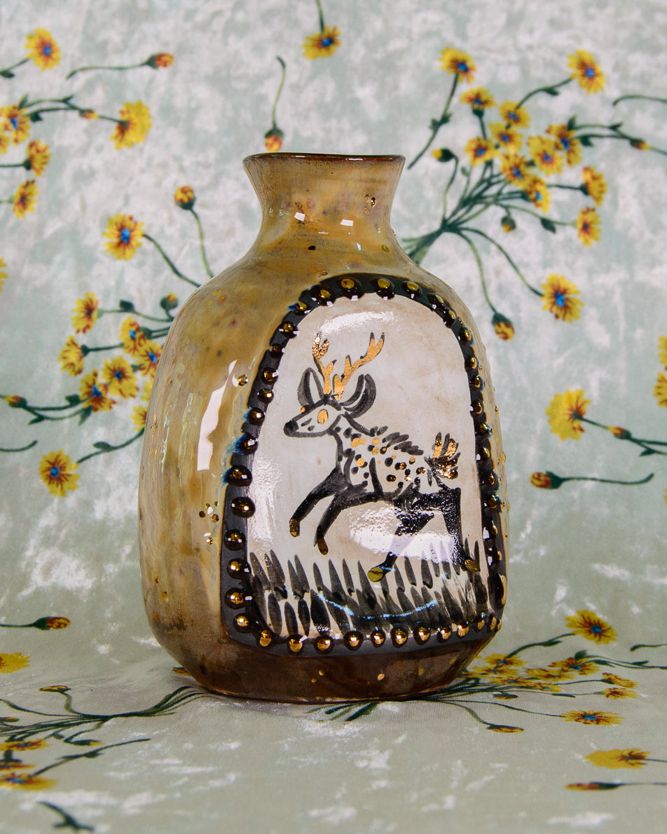 Decorative vase with animal design on a floral background