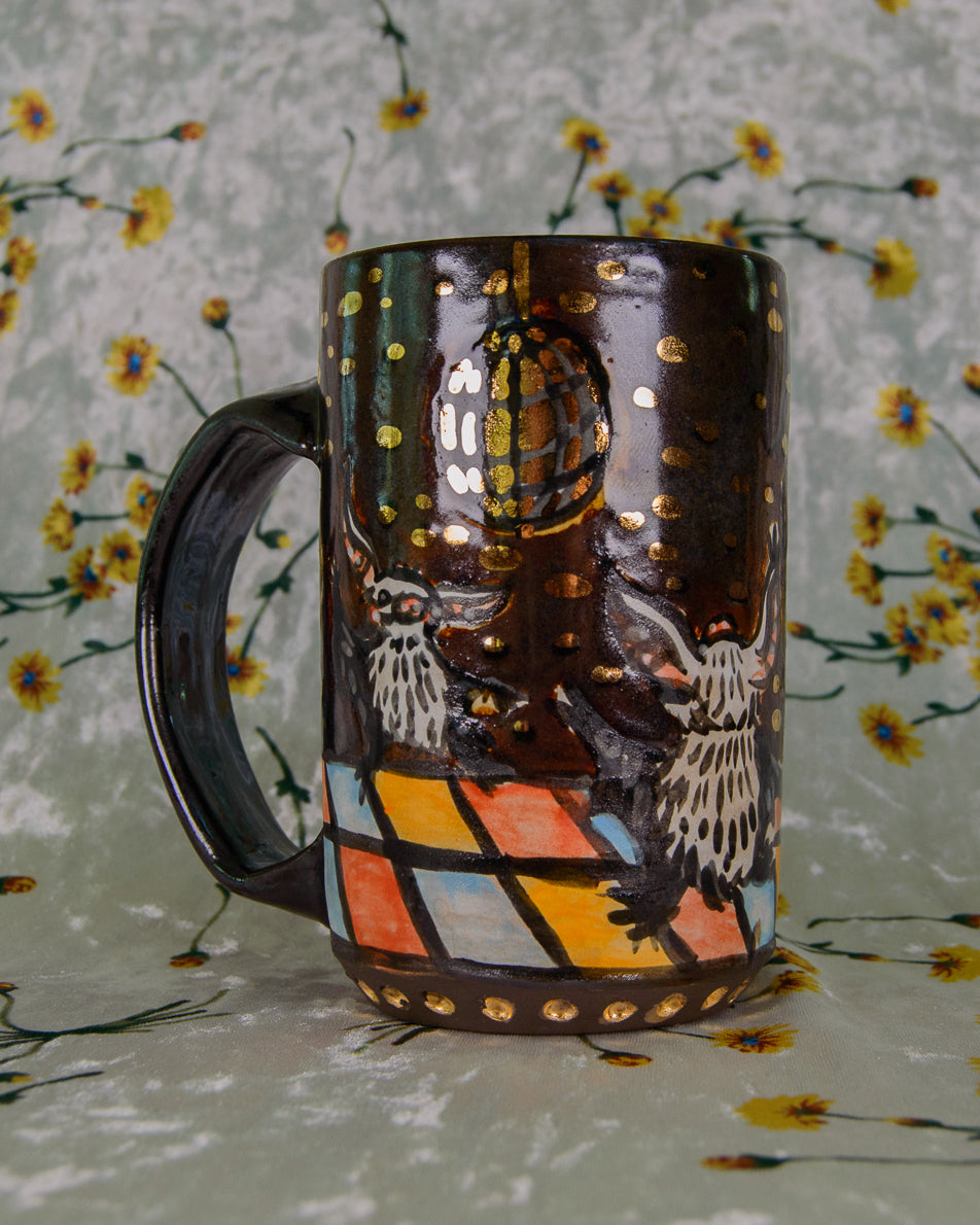Decorative ceramic mug with a gold disco ball and dancing bats design