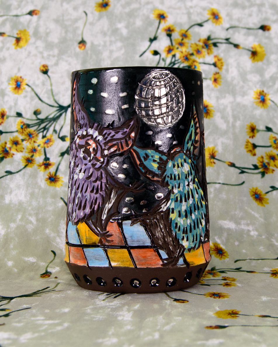Black decorative mug with dancing bat designs and reflective silver disco ball