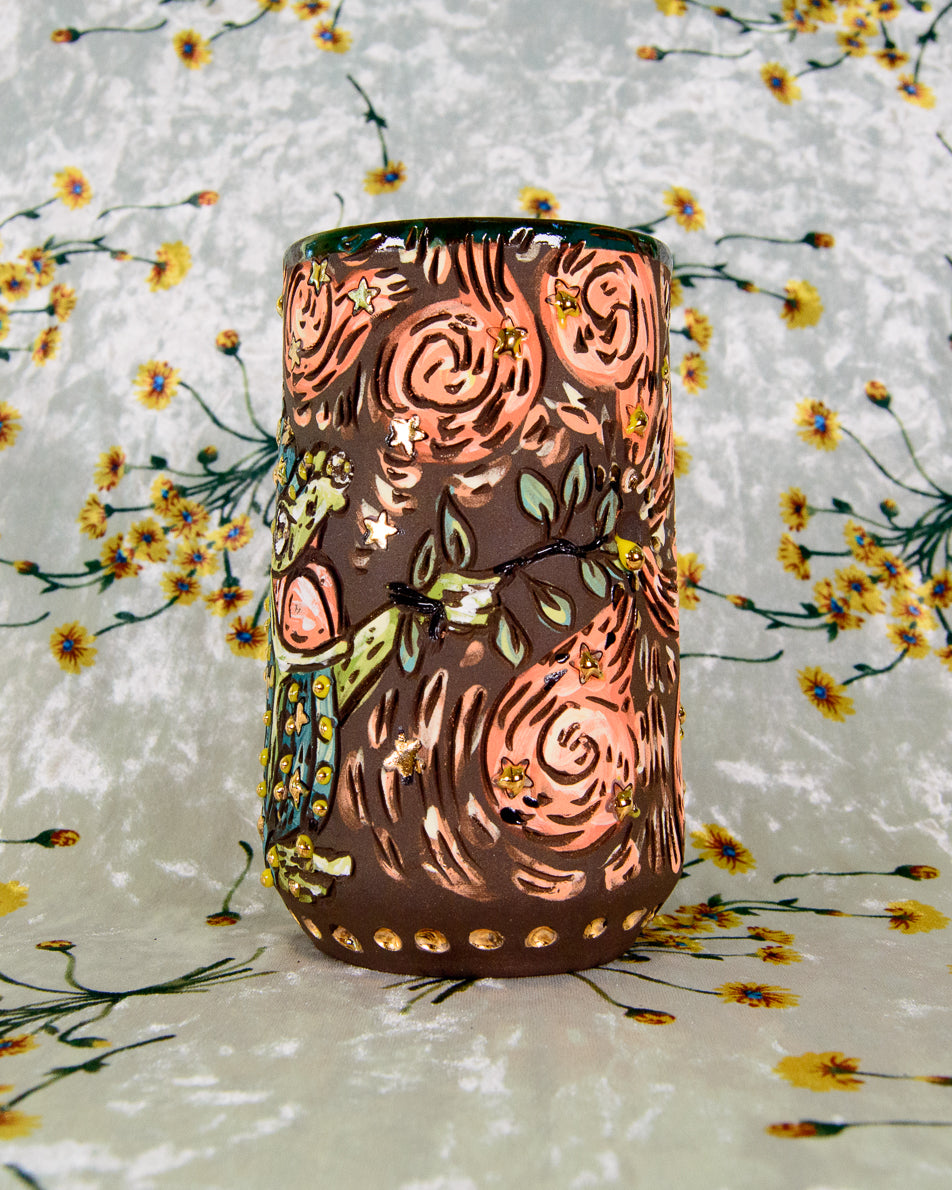 Intricate ceramic mug with gold star designs and cartoon magic swirls