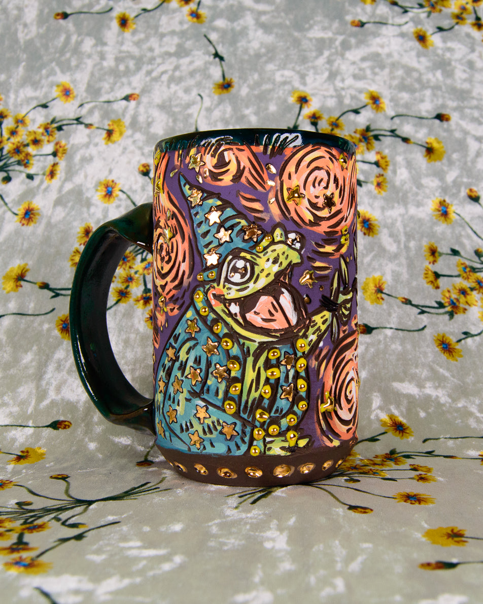 Colorful Ceramic mug with a cartoon frog wizard design and gold luster stars