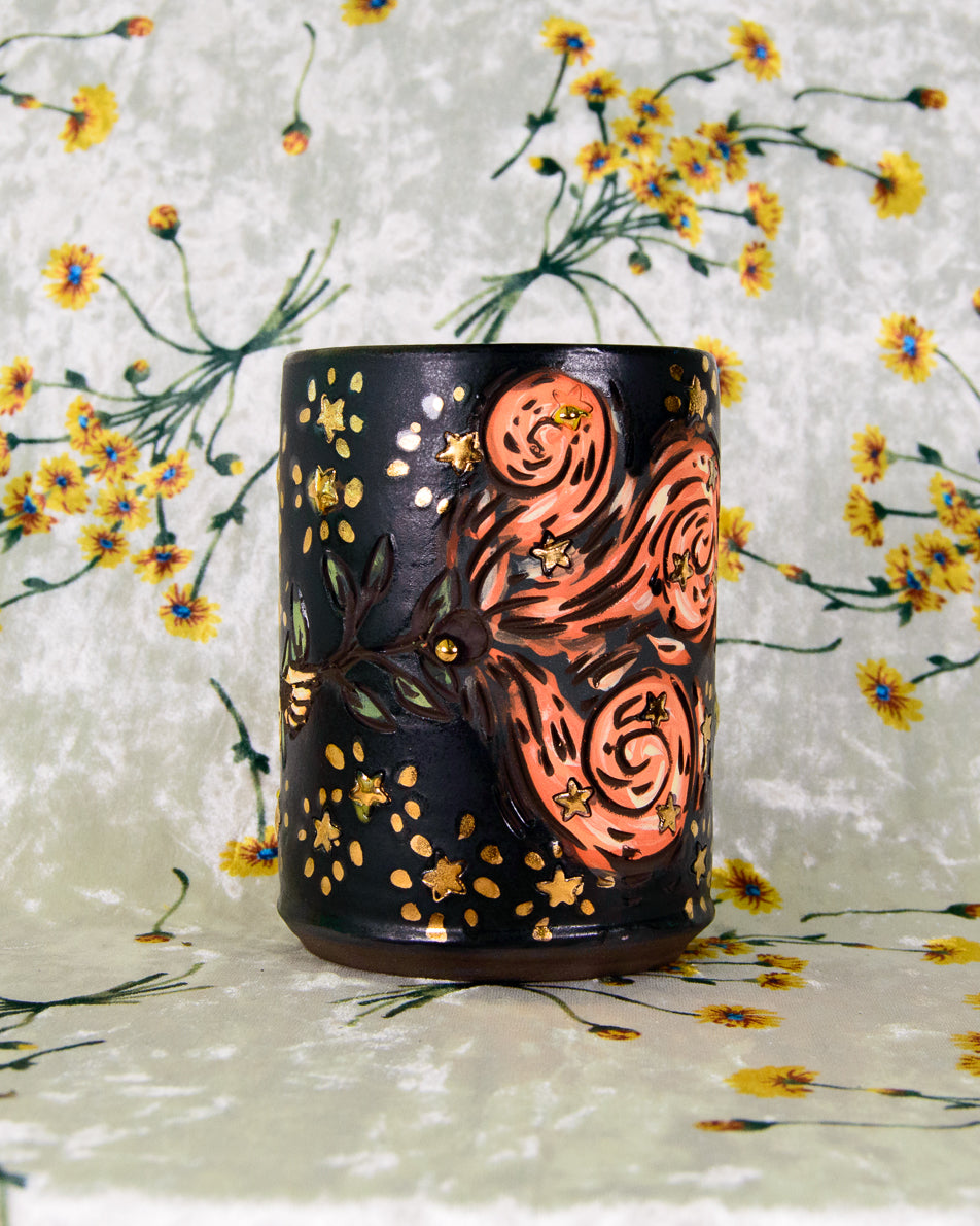 intricate ceramic cup with magic swirl and star designs