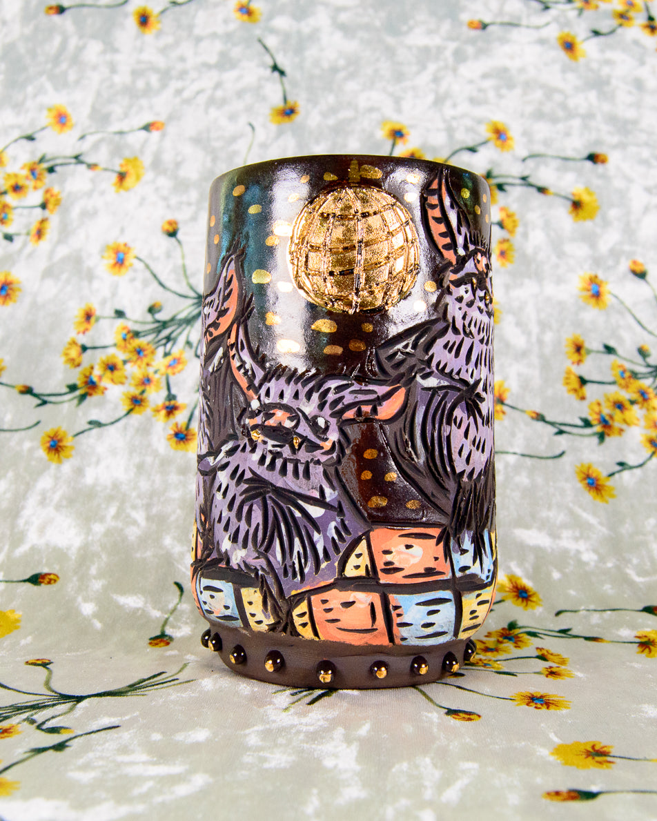 Handmade ceramic mug with cute cartoon bats dancing under a gold disco ball