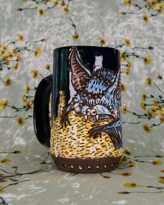 Decorative mug with artistic design of a cute bat on a floral background