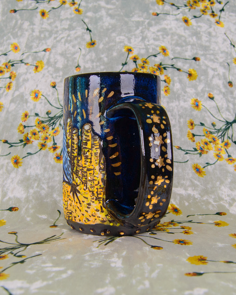 Decorative mug with artistic star design on a floral background