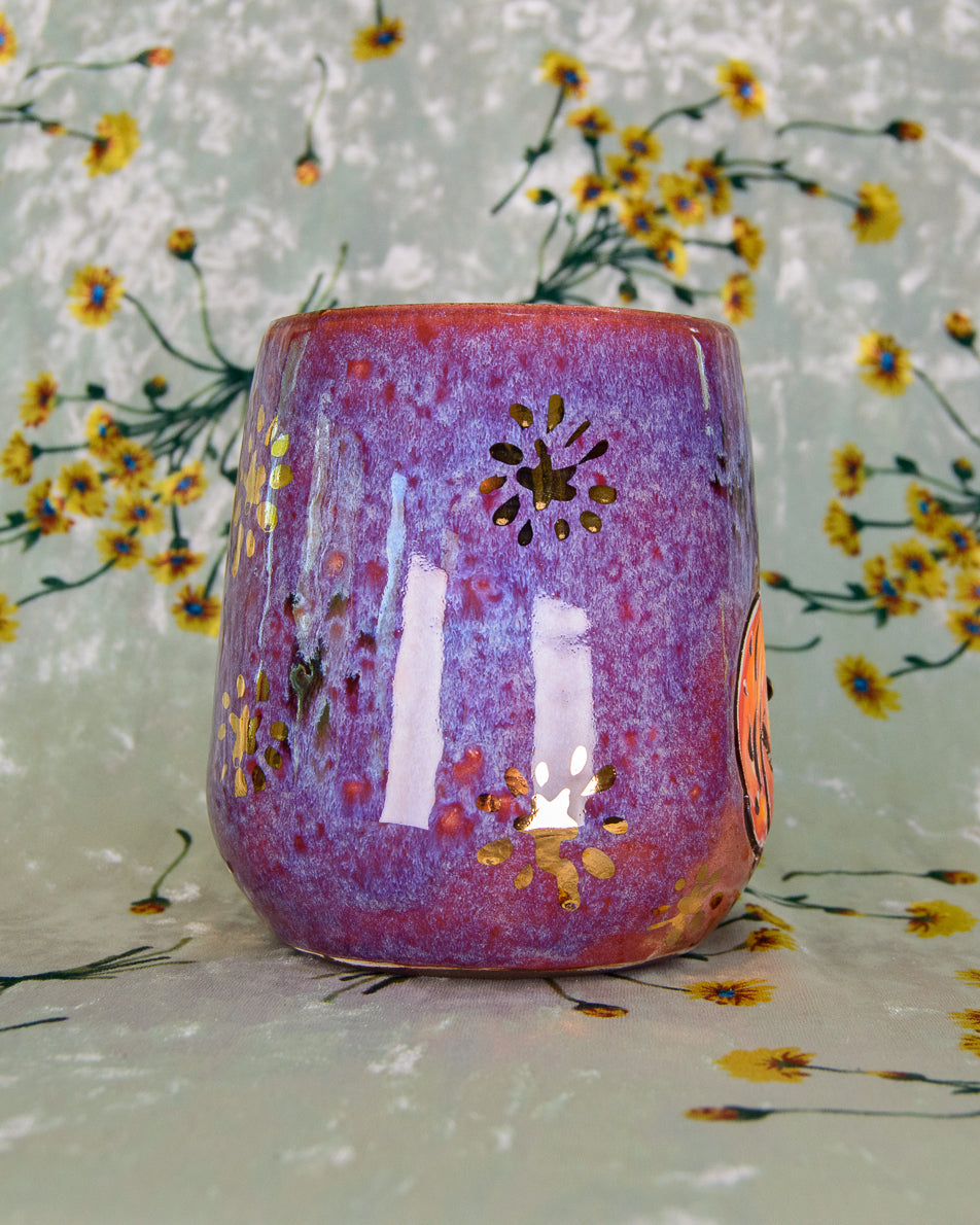 Ceramic wine cup with pretty purple and blue glaze and gold luster stars