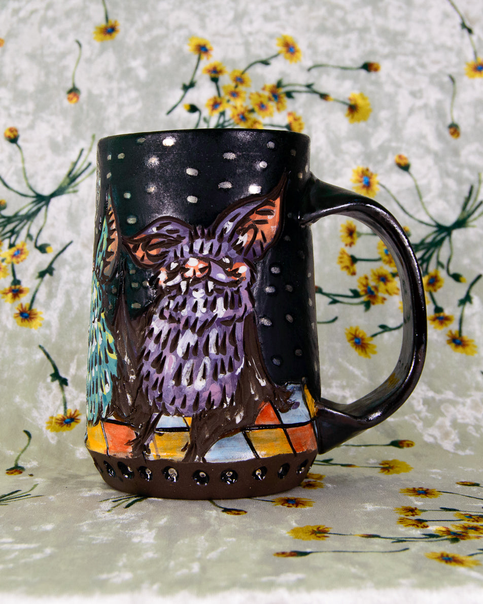 Black matte mug with a purple dancing bat design