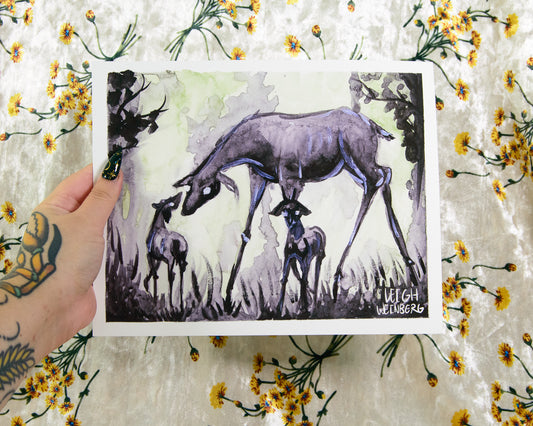 Art print of deer with two fawns held by a hand on a floral background