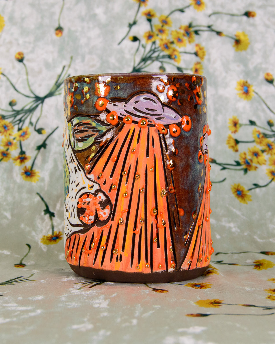 colorful ceramic cup with cartoon alien ship designs