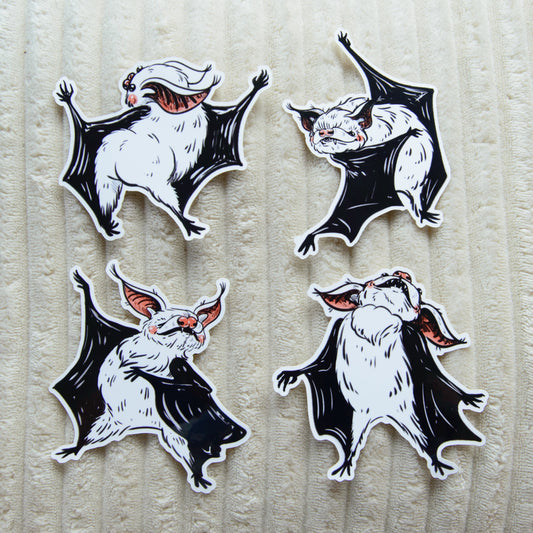 Four cute dancing bat stickers on a textured beige background