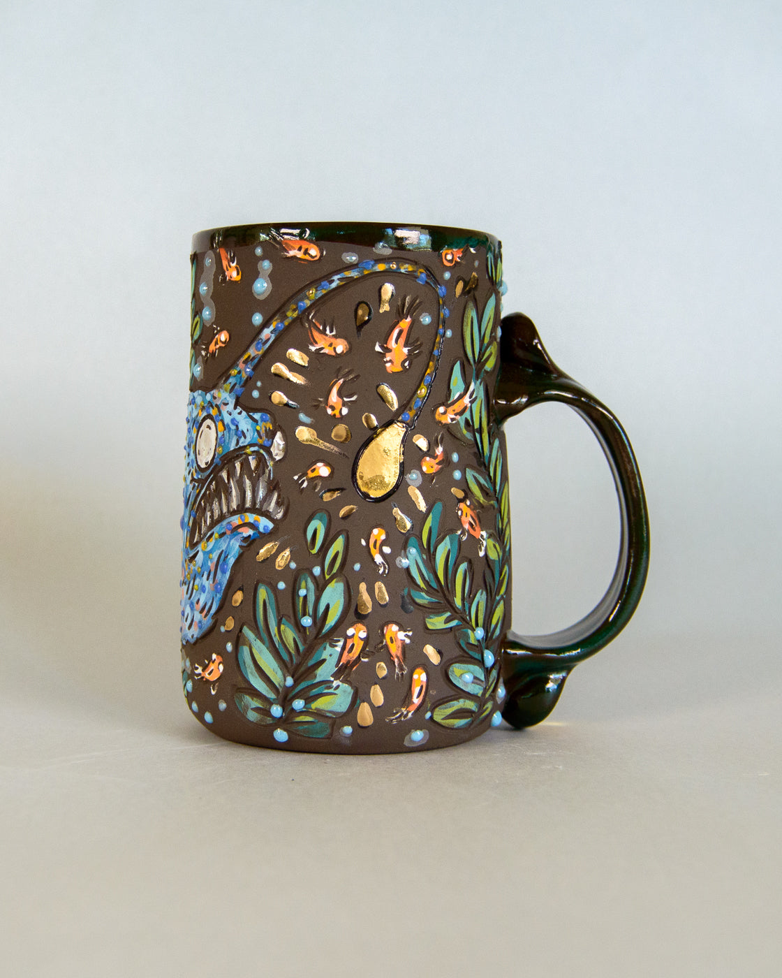 Decorative mug with colorful patterns on a light gray background
