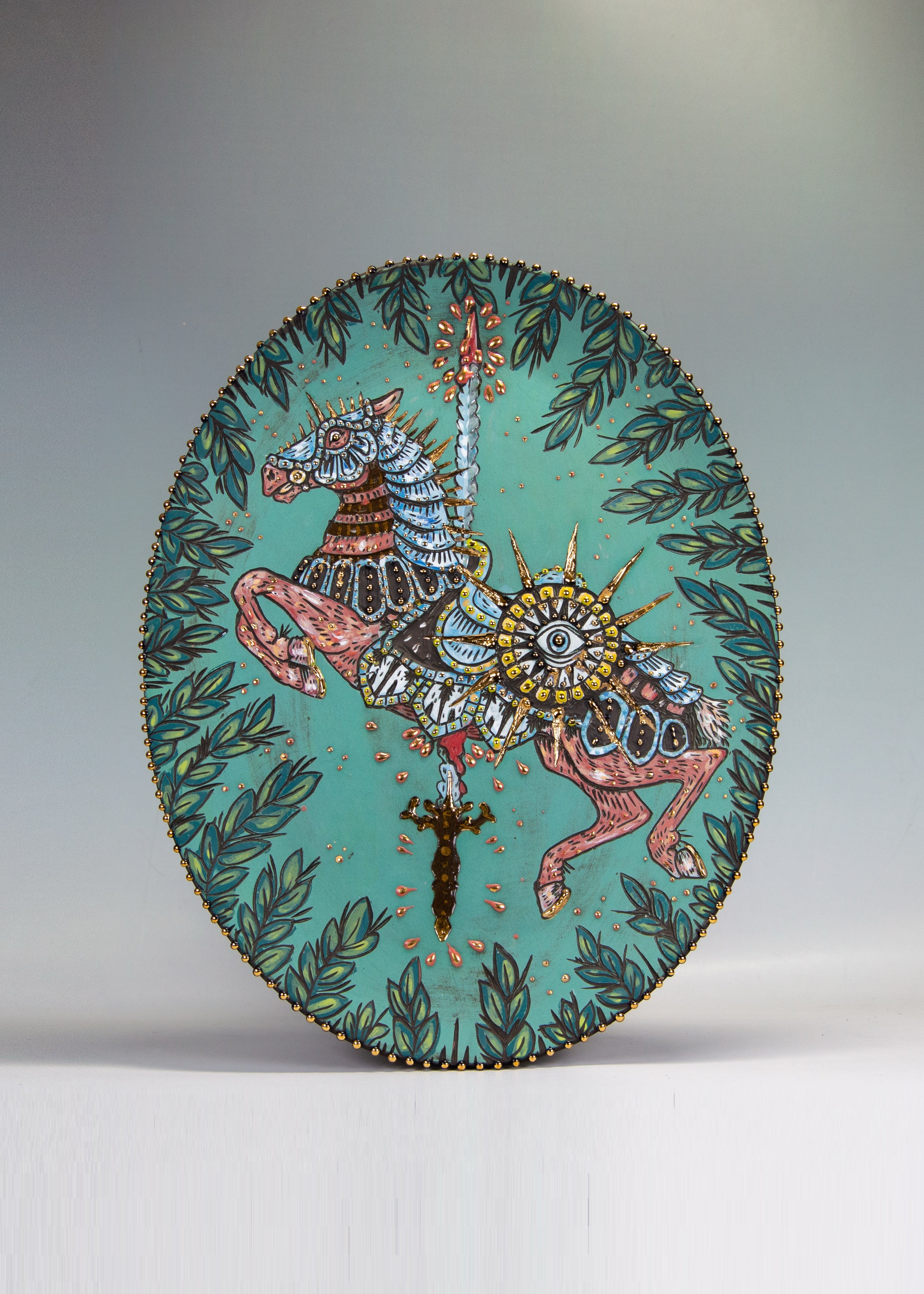 Handmade ceramic platter with a colorful armored carousel horse depicting war from the four horses of the apocalypse