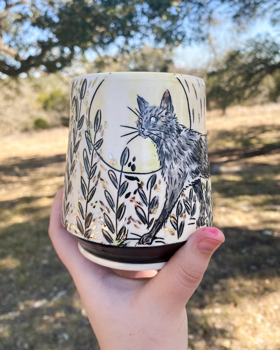 Handmade ceramic porcelain mug with a black cat design