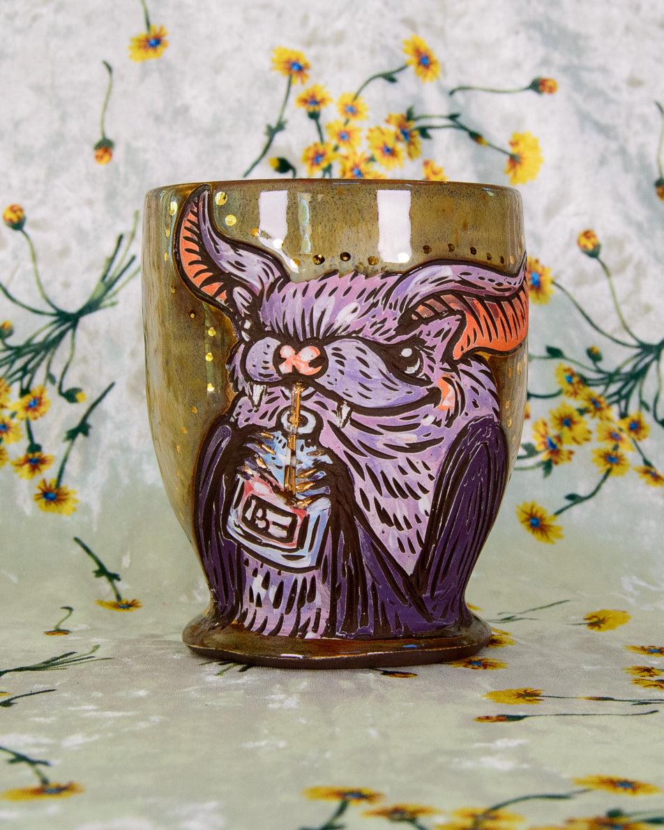 Handmade ceramic cup with a colorful and cute bat drinking a blood bag