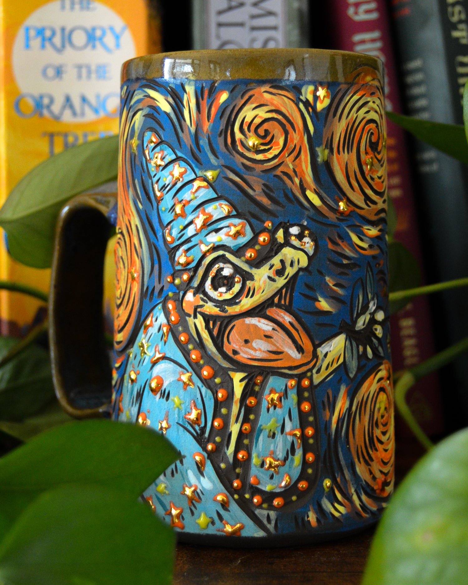 Handmade ceramic stoneware mug with a magical cute frog wizard design