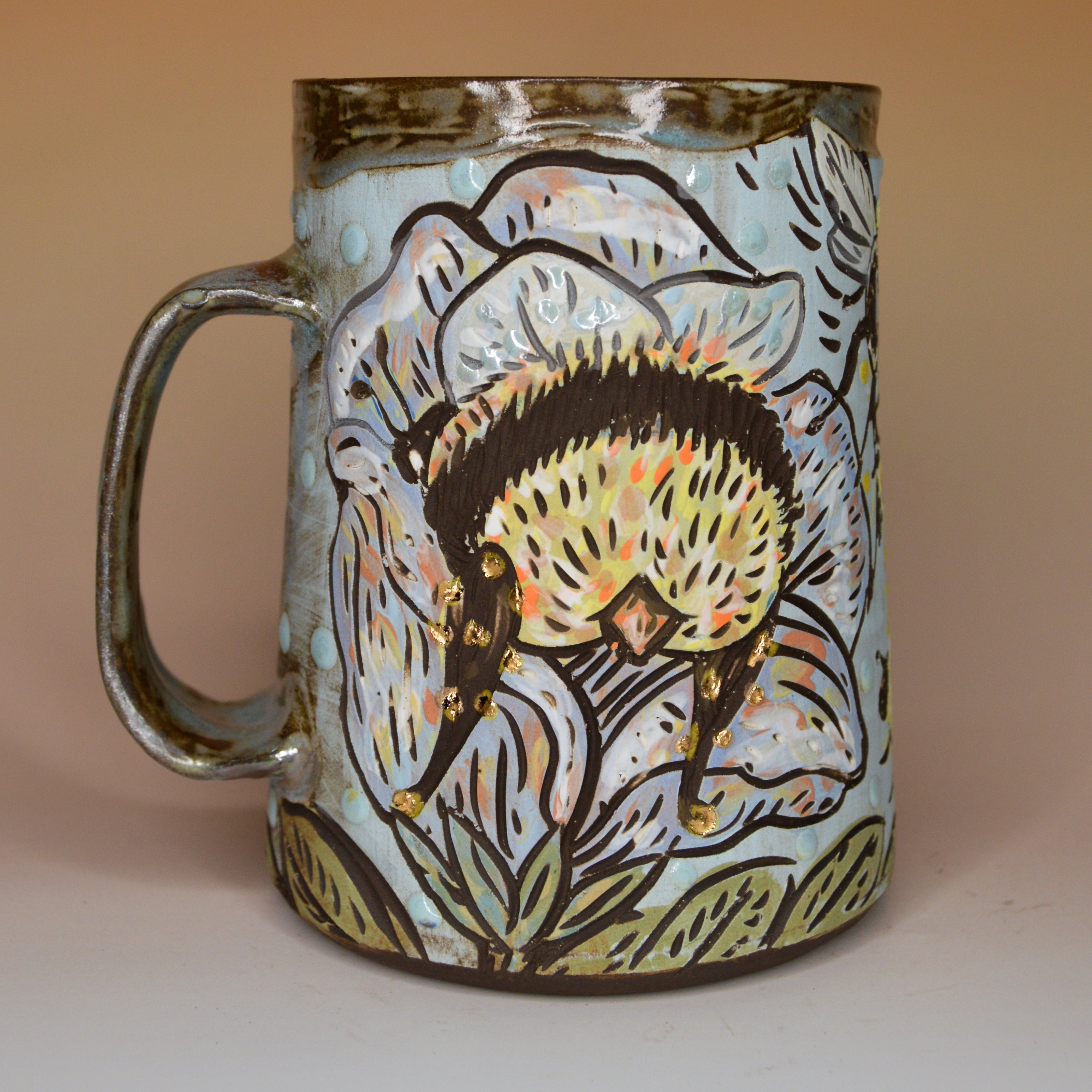 Handmade ceramic stoneware mug with a bee sleeping in a flower design