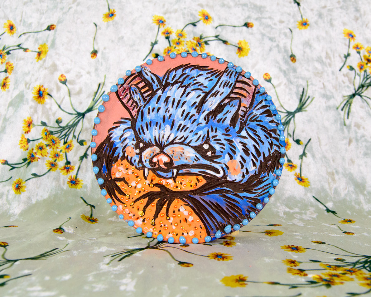 Hand made, colorful round Ceramic Coaster with a stylized Bat design on a floral background