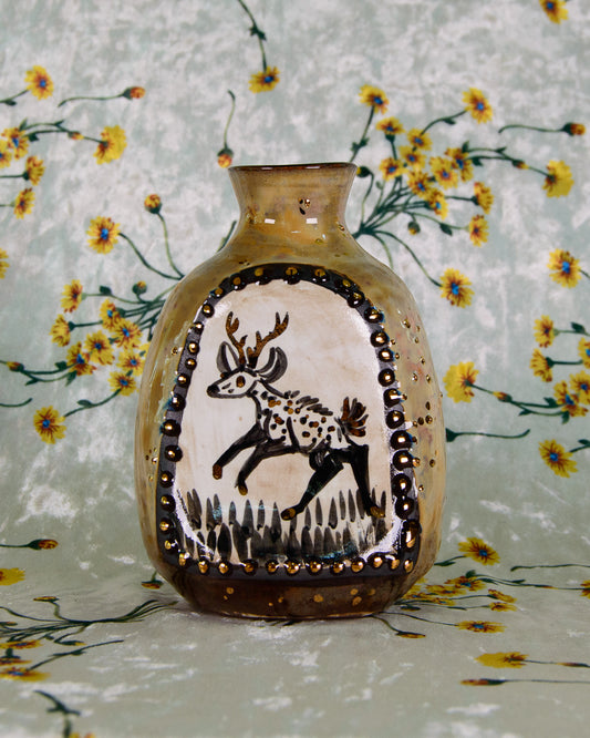 Decorative vase with a deer design on a floral background