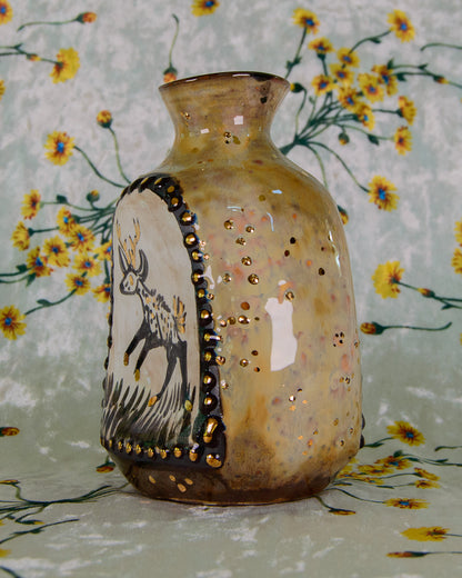 Decorative vase with a deer design on a floral background