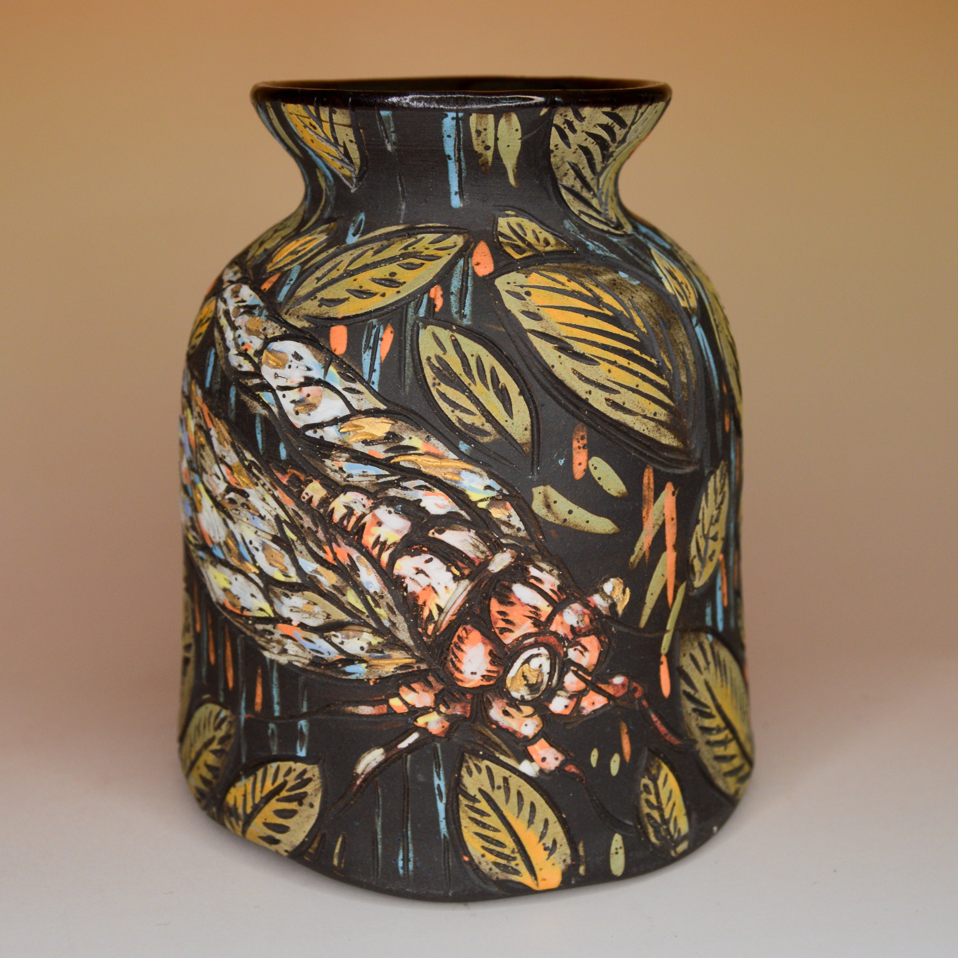Handmade ceramic stoneware vase with a stylized cicada and leaf design