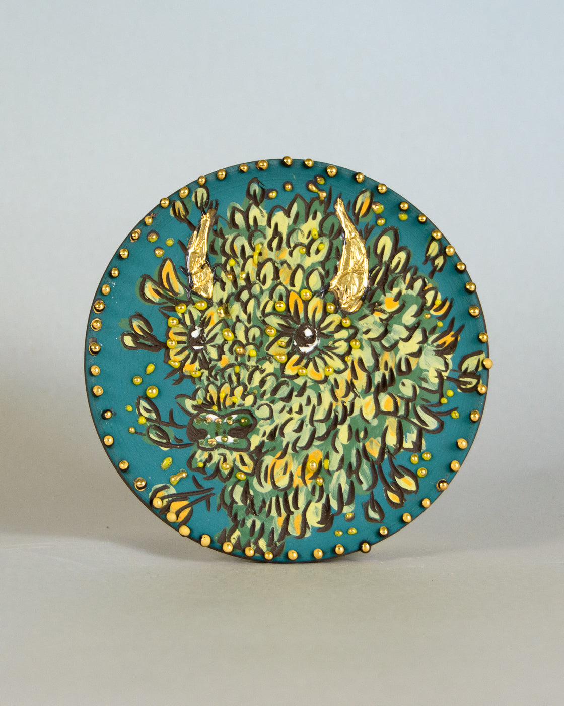 Ceramic coaster with bison design