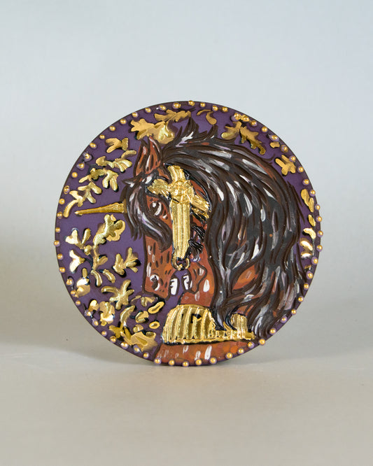 Ceramic coaster with unicorn design
