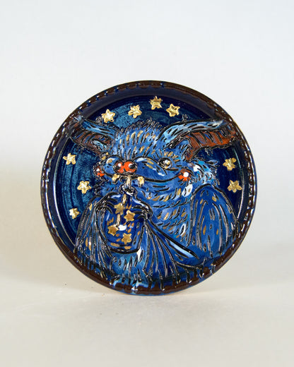 Ceramic coaster with bat design