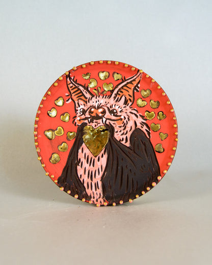 Ceramic coaster with bat and heart design