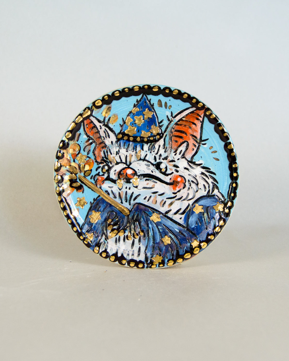 Ceramic coaster with wizard bat design