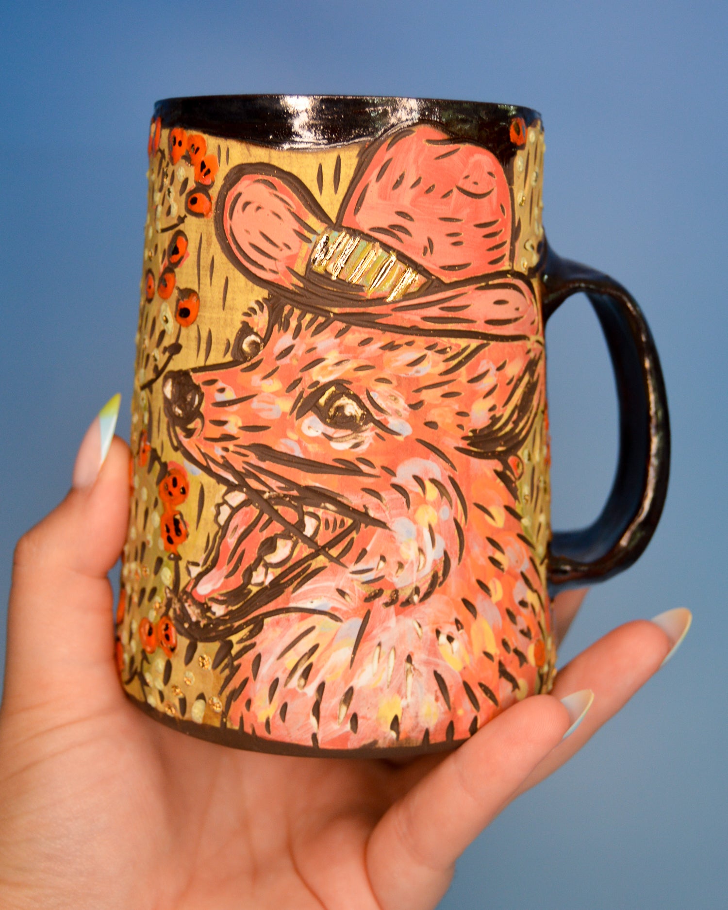 Handmade ceramic stoneware mug with a coyote wearing a cowboy hat