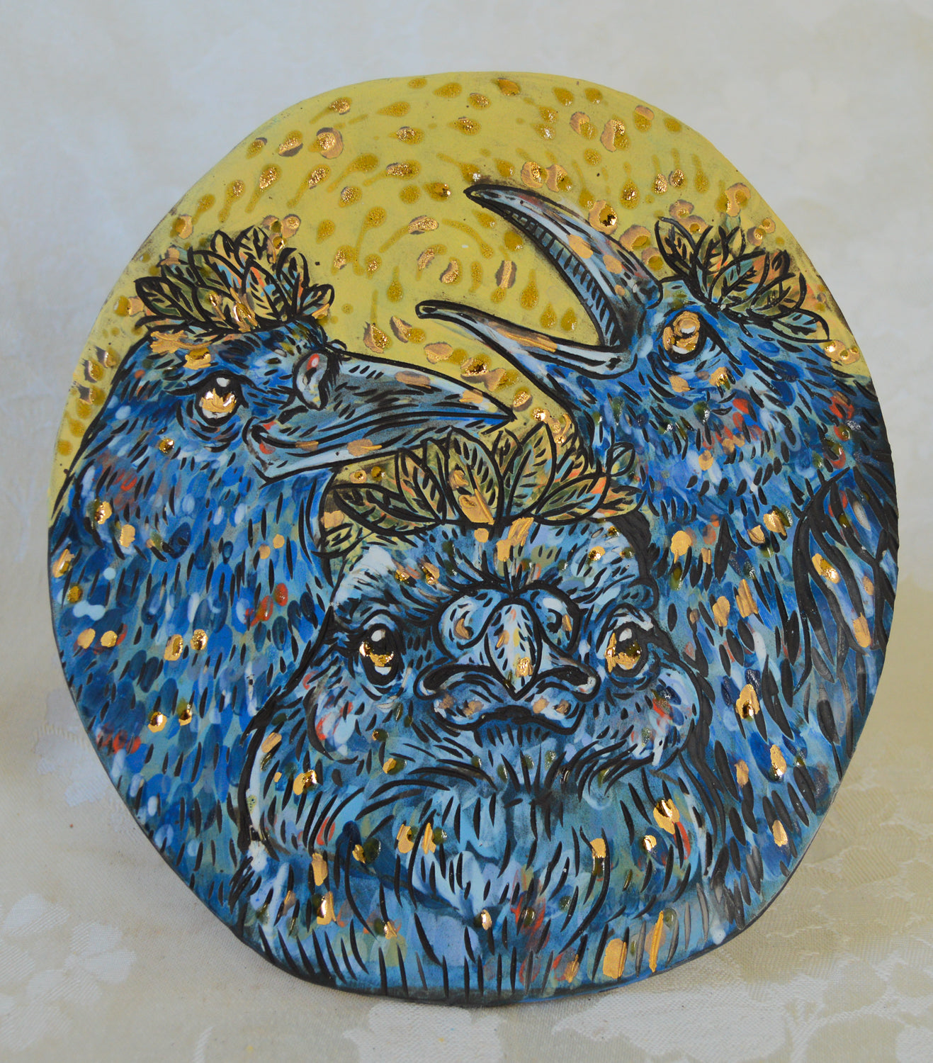 Handmade ceramic stoneware plaque with crow and leaf designs