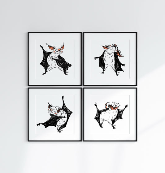 Four framed illustrations of bats on a white wall