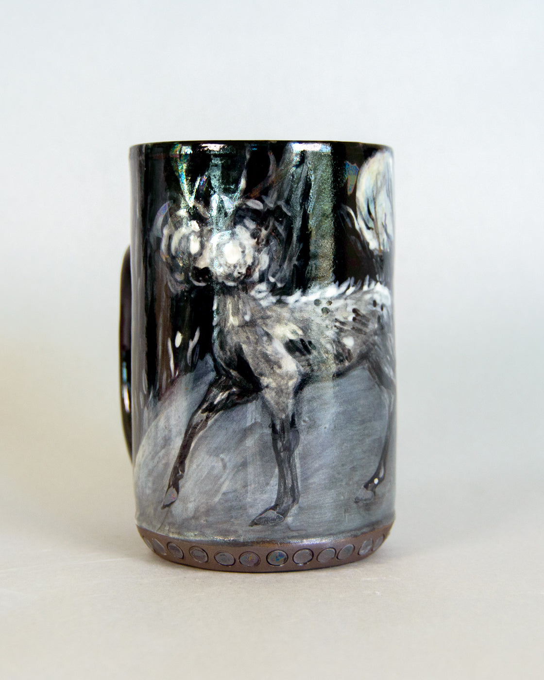 Ceramic mug with a deer design on a white background
