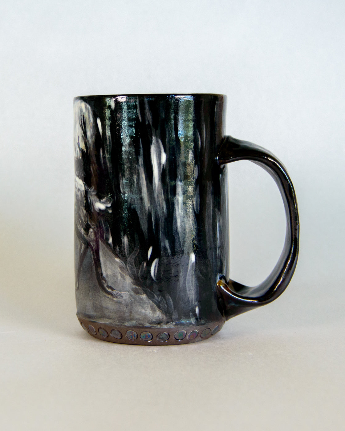 Black marbled ceramic mug on a white background