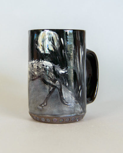 Mug with a deer and moon design on a white background
