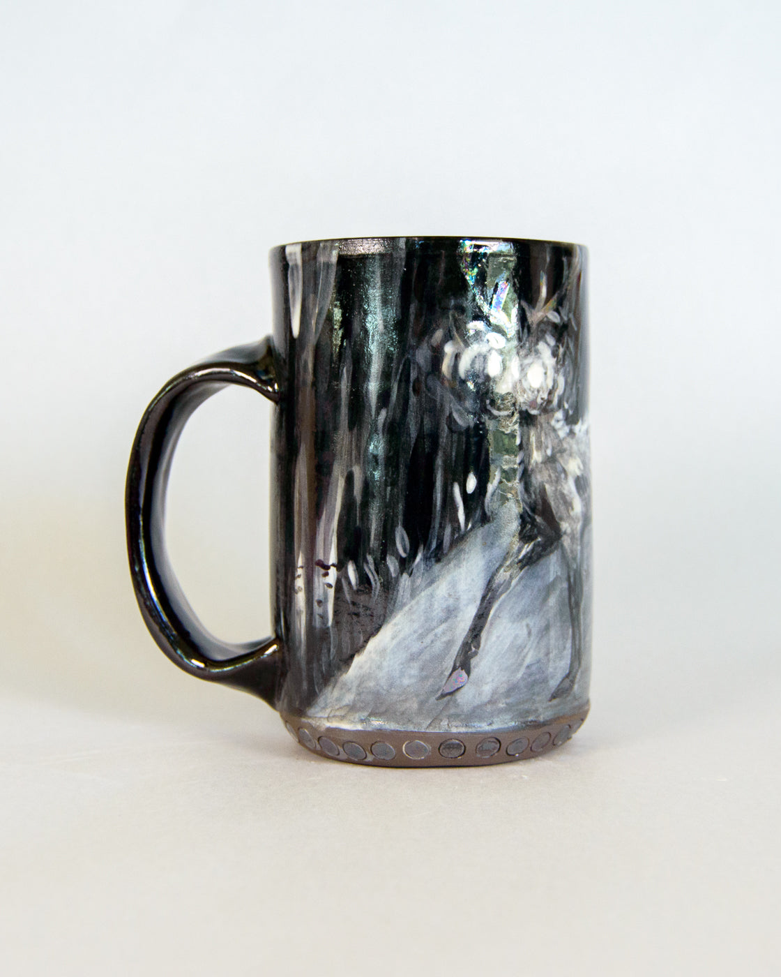 Black and white marbled ceramic mug on a white background