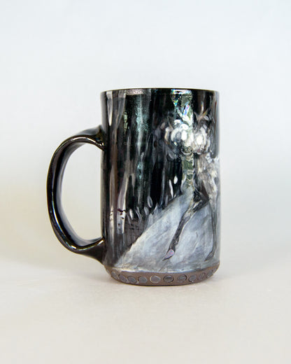 Black and white marbled ceramic mug on a white background