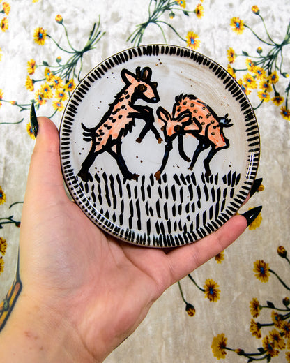 white ceramic coaster with red deer fawn designs