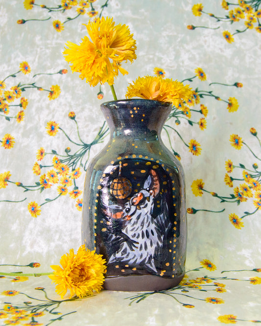 Decorative ceramic vase with a dancing disco bat design surrounded by yellow flowers on a floral background