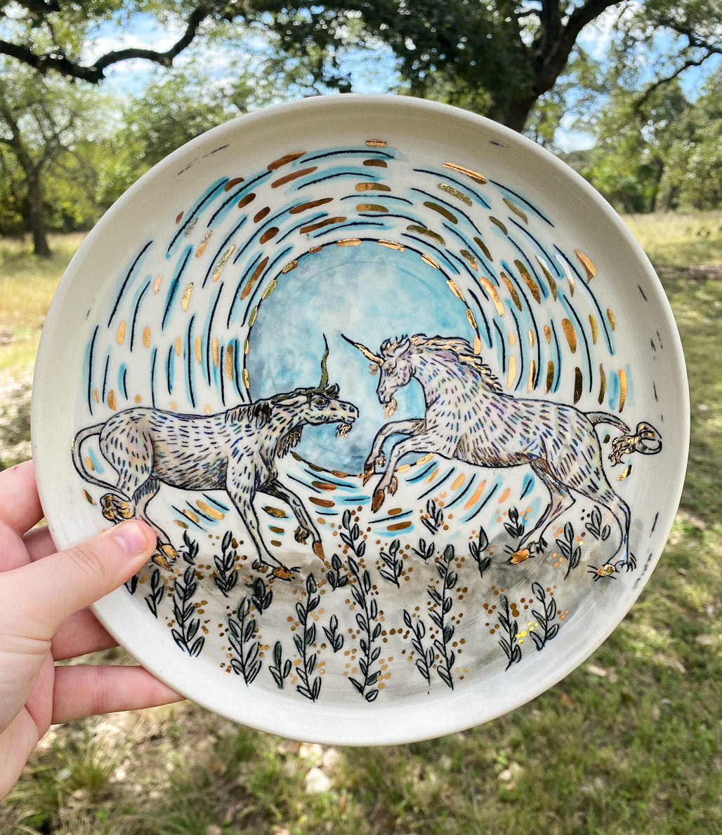 Handmade ceramic porcelain plate with fighting unicorns design