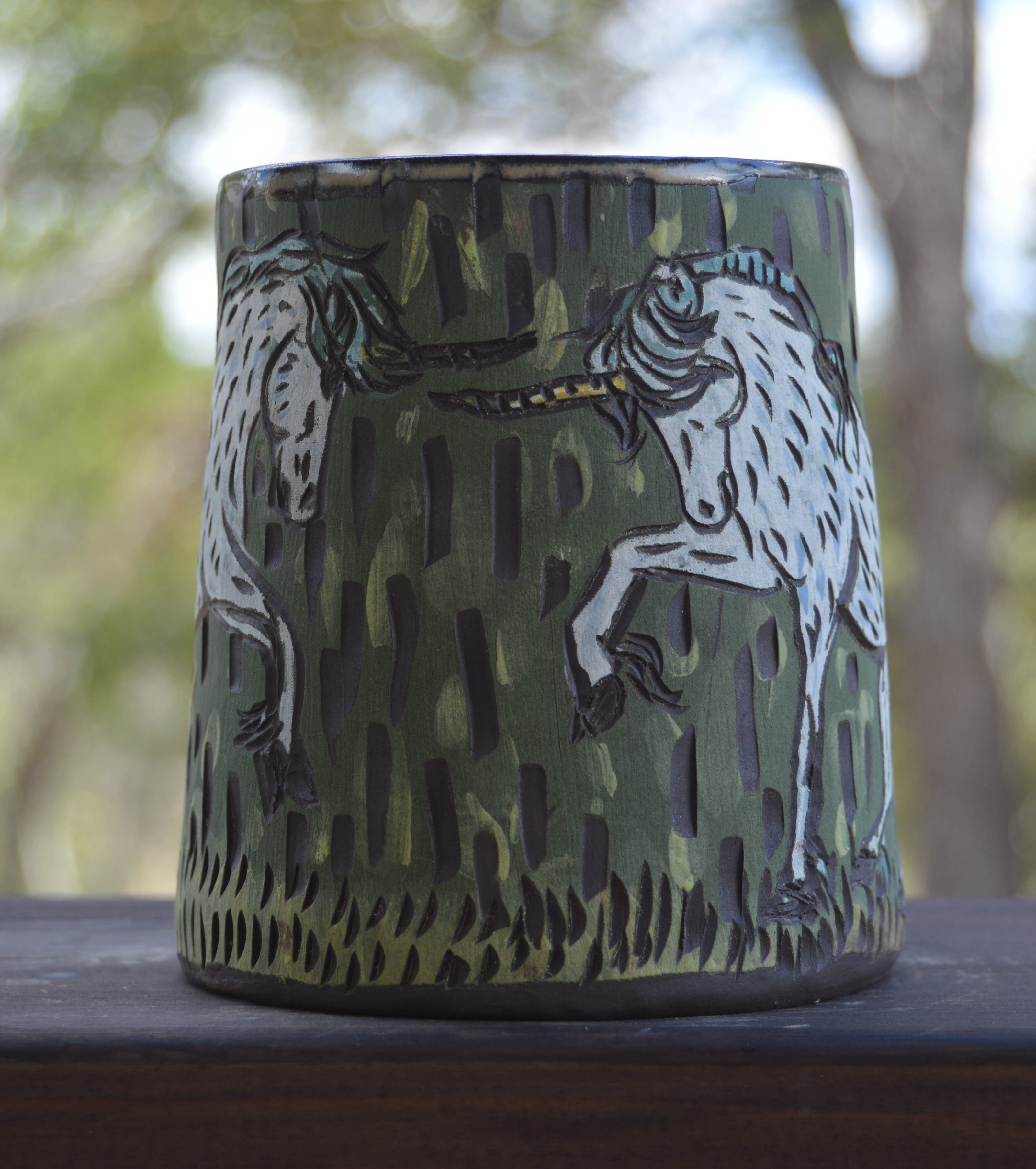 Handmade ceramic stoneware mug with dueling unicorns design