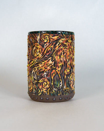 Cylindrical ceramic mug with abstract flame-like design on a white background