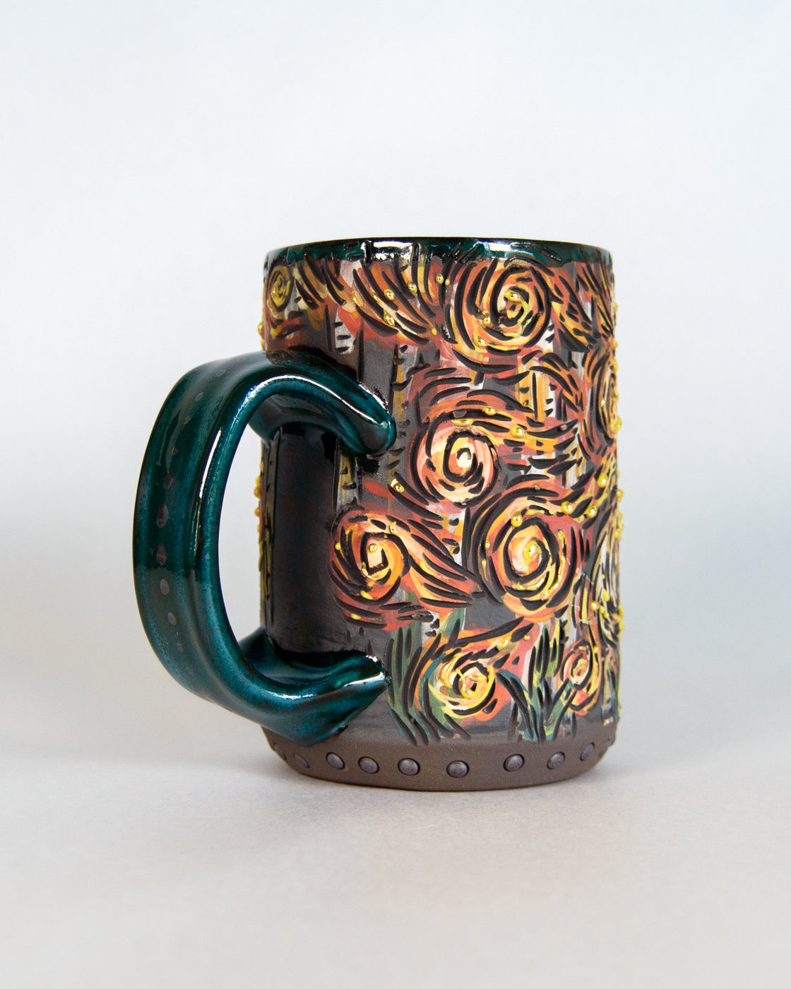 Ceramic mug with a colorful abstract design on a white background