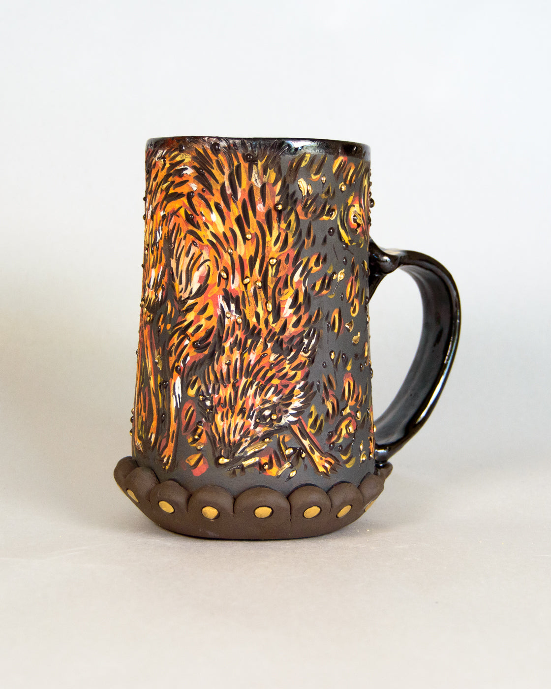 Ceramic mug with fox pattern on a white background