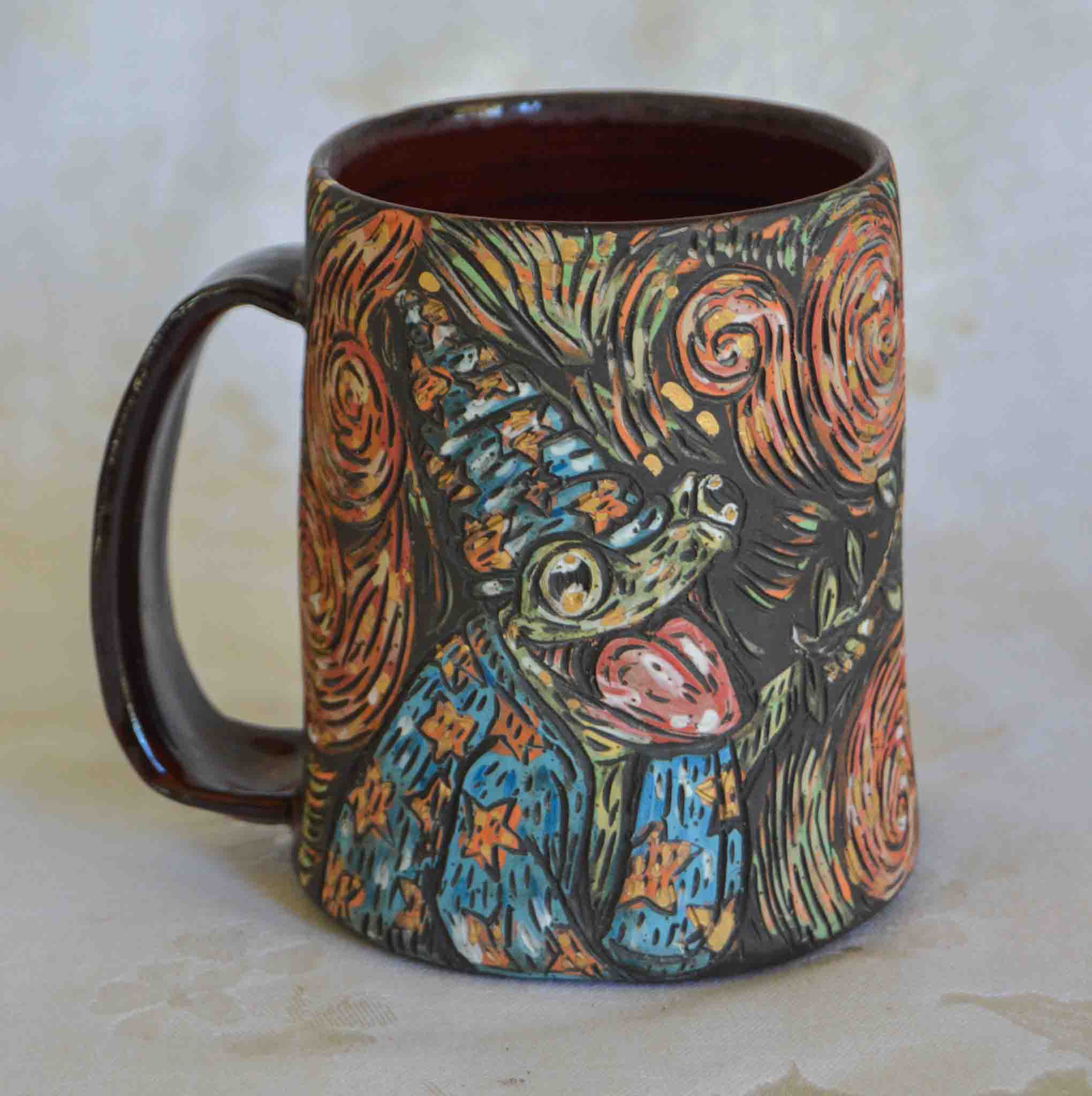 Handmade ceramic stoneware mug with a cute magic frog wizard design