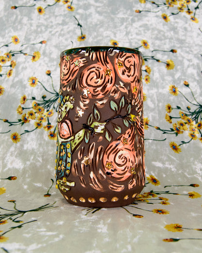 Intricate ceramic mug with gold star designs and cartoon magic swirls