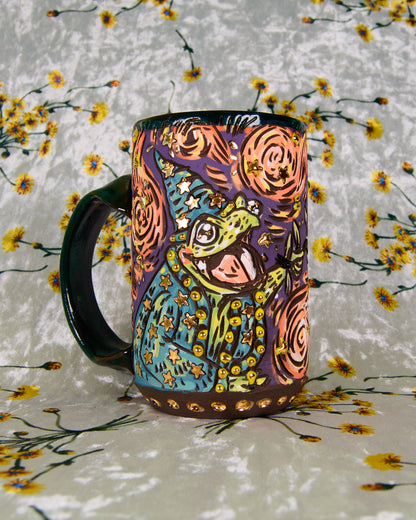 Colorful Ceramic mug with a cartoon frog wizard design and gold luster stars