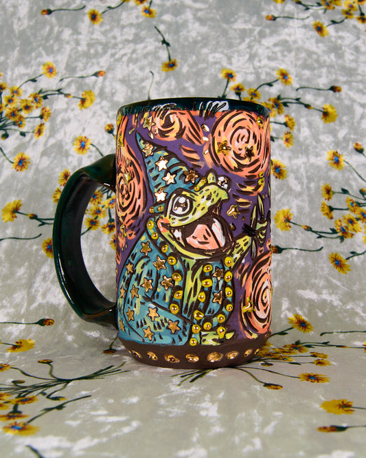 Colorful Ceramic mug with a cartoon frog wizard design and gold luster stars